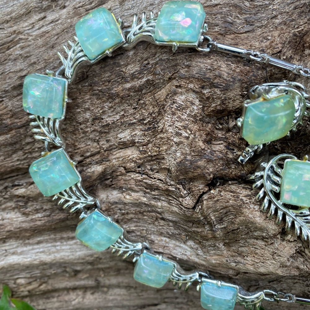 Coro 1950’s set featuring blue confetti Lucite with silver leaf design